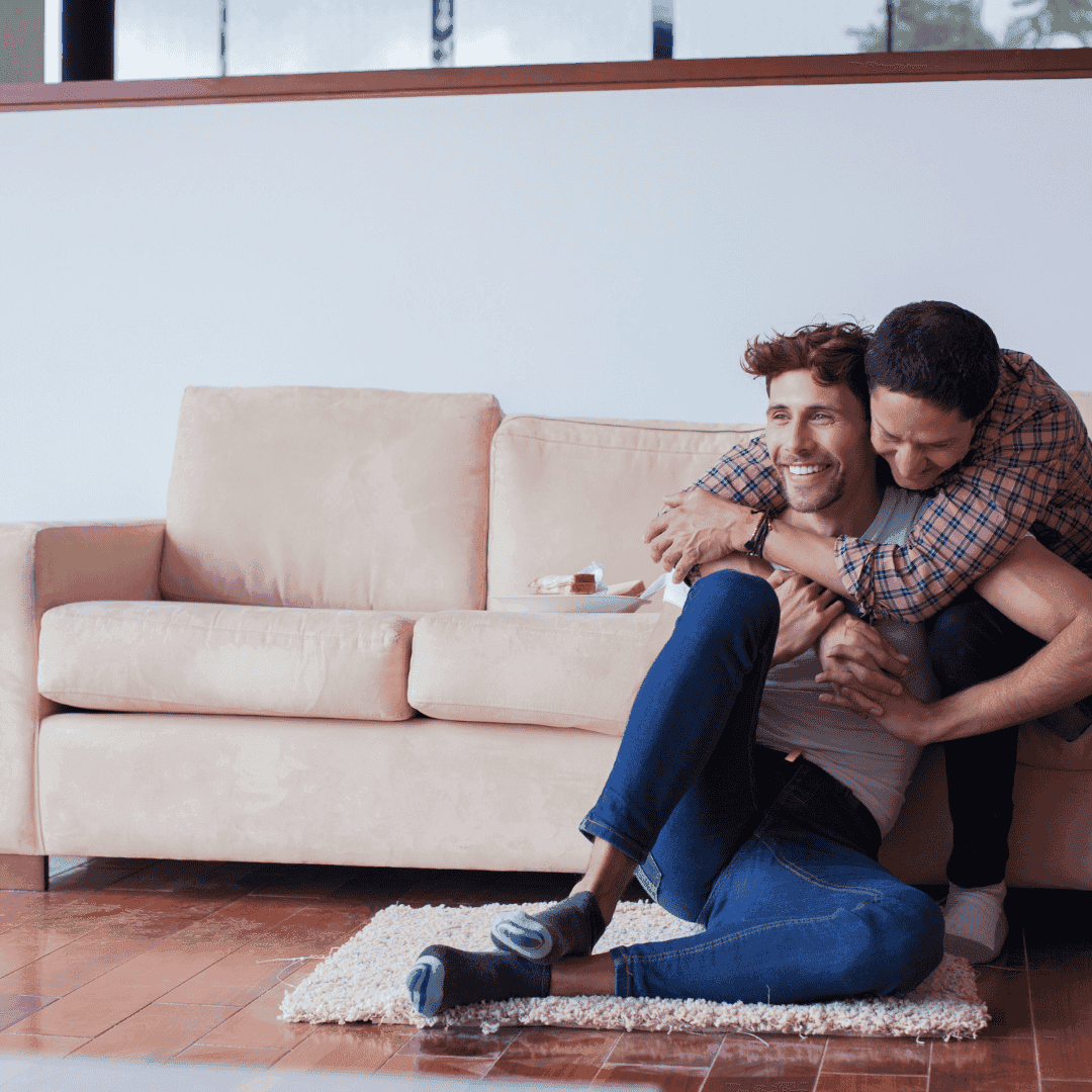 A family celebrating their new home in an Exit 120 housing project